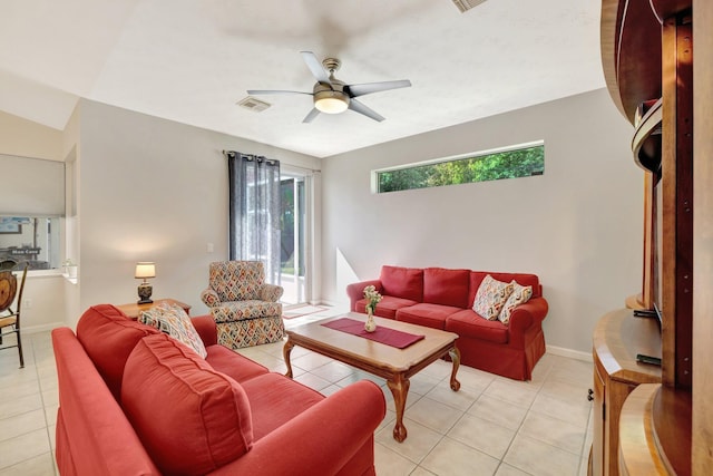 2857 SE Pace Dr, Port Saint Lucie, FL 34984 - living room featuring visible vents, baseboards, a ceiling fan, and light tile patterned flooring
