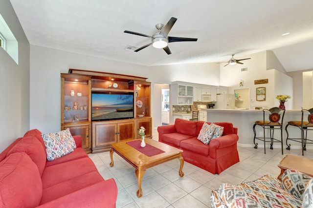 2857 SE Pace Dr, Port Saint Lucie, FL 34984 - living area with light tile patterned floors, visible vents, a ceiling fan, and lofted ceiling