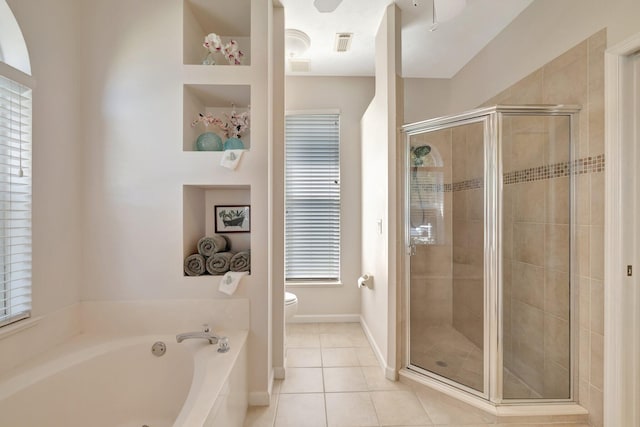 2857 SE Pace Dr, Port Saint Lucie, FL 34984 - bathroom with visible vents, toilet, tile patterned floors, a stall shower, and a garden tub