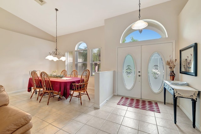 2857 SE Pace Dr, Port Saint Lucie, FL 34984 - entrance foyer with high vaulted ceiling, light tile patterned flooring, baseboards, and visible vents