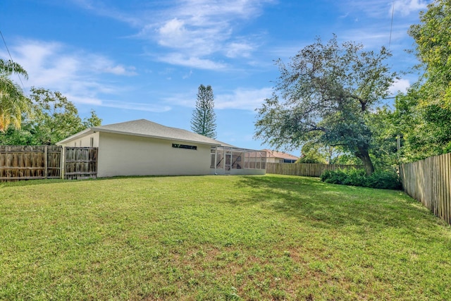 2857 SE Pace Dr, Port Saint Lucie, FL 34984 - view of yard featuring a fenced backyard and a lanai