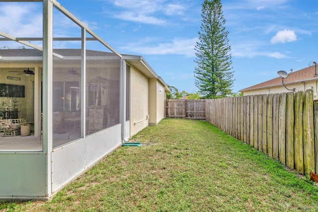 2857 SE Pace Dr, Port Saint Lucie, FL 34984 - view of yard featuring a lanai, a fenced backyard, and a ceiling fan