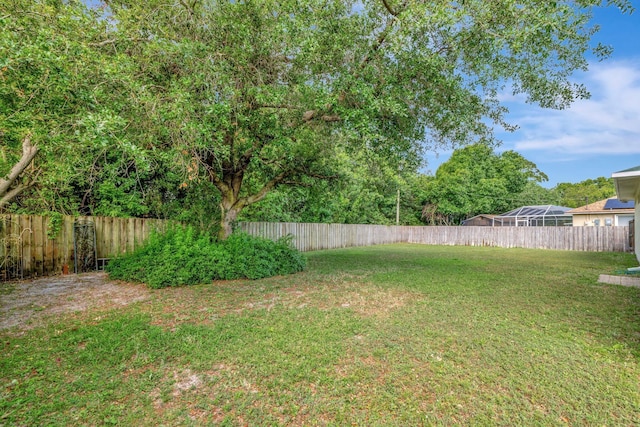 2857 SE Pace Dr, Port Saint Lucie, FL 34984 - view of yard with a fenced backyard
