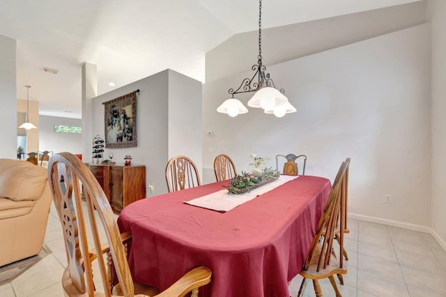 2857 SE Pace Dr, Port Saint Lucie, FL 34984 - dining space featuring a chandelier, light tile patterned floors, baseboards, and lofted ceiling