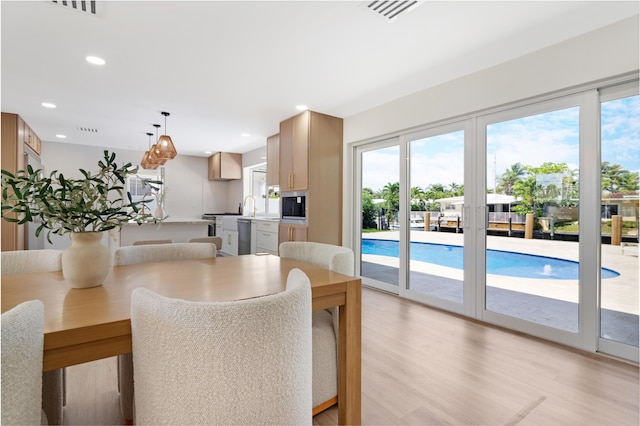 841 SE 5th Ter, Pompano Beach, FL 33060 - dining room featuring recessed lighting, visible vents, and light wood-style flooring