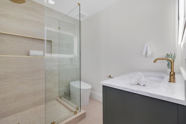 841 SE 5th Ter, Pompano Beach, FL 33060 - full bathroom featuring toilet, wood finished floors, vanity, and a tile shower