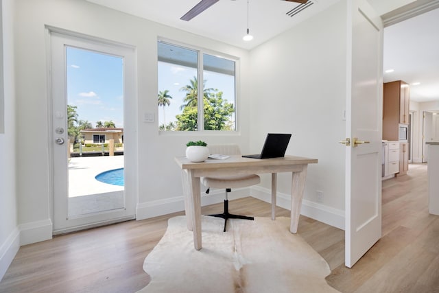 841 SE 5th Ter, Pompano Beach, FL 33060 - office area with light wood-type flooring, a wealth of natural light, and baseboards