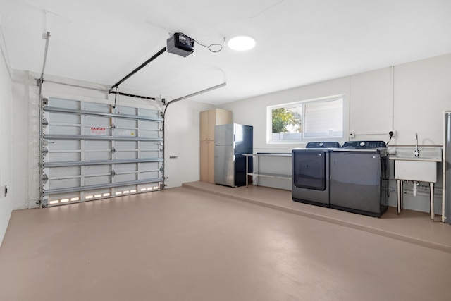 841 SE 5th Ter, Pompano Beach, FL 33060 - garage with separate washer and dryer, a garage door opener, a sink, and freestanding refrigerator
