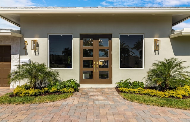 841 SE 5th Ter, Pompano Beach, FL 33060 - doorway to property with stucco siding and french doors