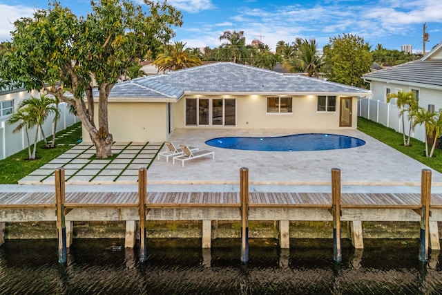 841 SE 5th Ter, Pompano Beach, FL 33060 - view of swimming pool with a fenced backyard, a water view, a patio, and a fenced in pool