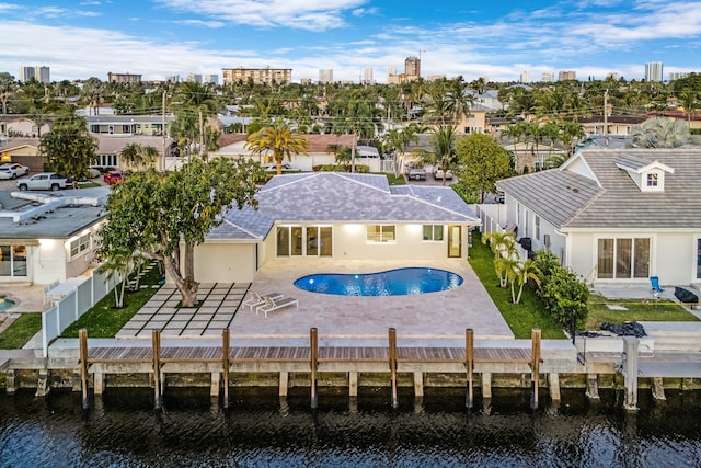 841 SE 5th Ter, Pompano Beach, FL 33060 - back of house with a patio area, a fenced backyard, an outdoor pool, and a water view