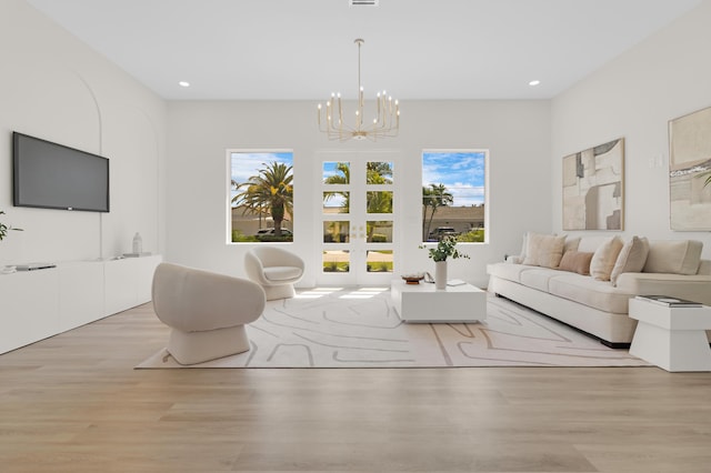 841 SE 5th Ter, Pompano Beach, FL 33060 - living area with an inviting chandelier, french doors, wood finished floors, and recessed lighting