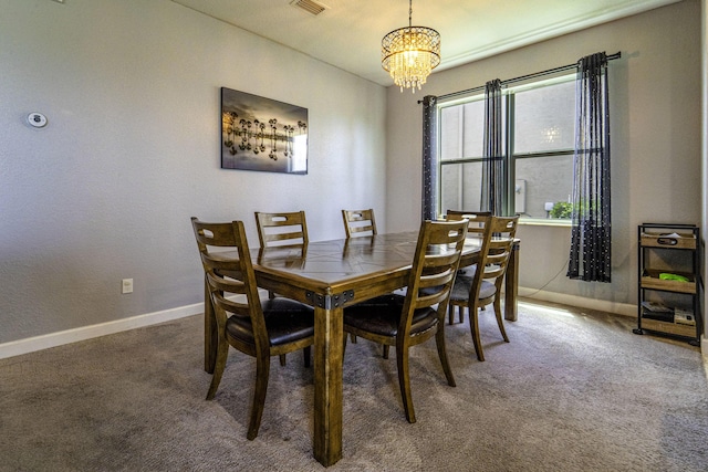 dining room featuring visible vents, carpet floors, baseboards, and an inviting chandelier