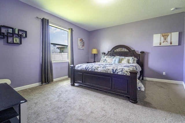 bedroom featuring carpet floors and baseboards