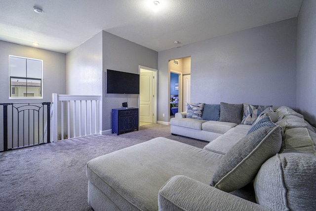 living area featuring visible vents, baseboards, and carpet flooring