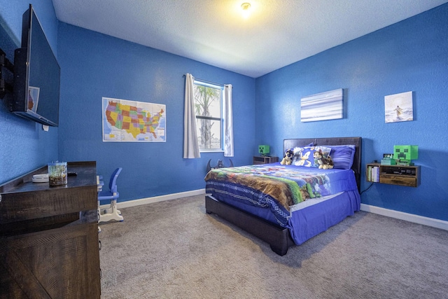 bedroom with carpet floors, a textured ceiling, and baseboards