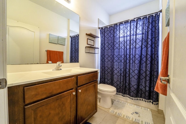 bathroom with tile patterned floors, vanity, a shower with shower curtain, and toilet