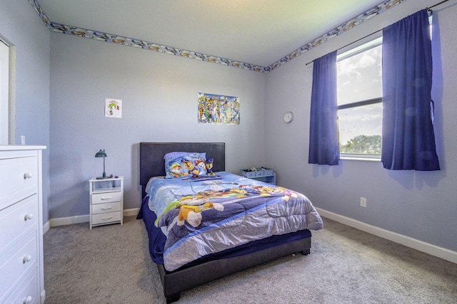 carpeted bedroom with baseboards