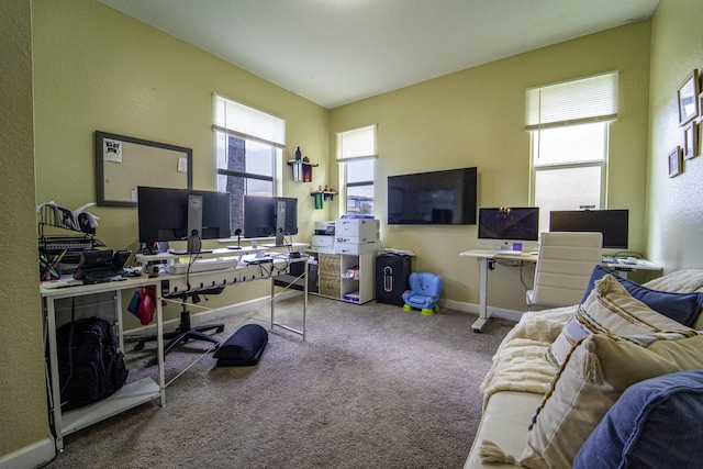 office space with a textured wall, carpet flooring, and baseboards