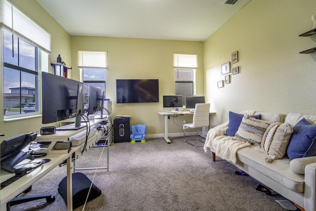 carpeted living room with baseboards