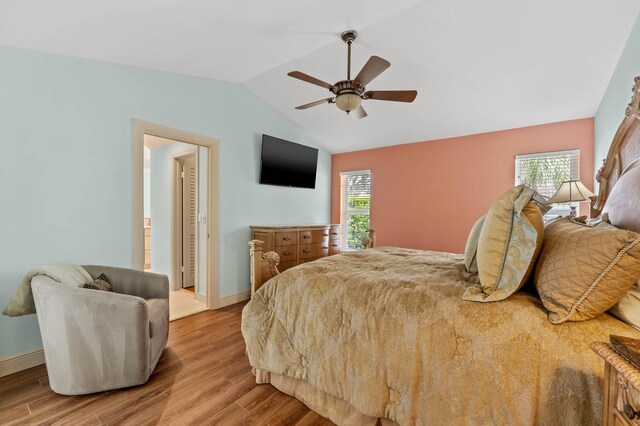 bedroom with lofted ceiling, ceiling fan, baseboards, and light wood-type flooring
