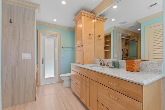 full bathroom featuring a shower stall, visible vents, toilet, vanity, and ornamental molding
