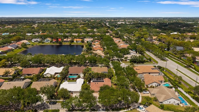 birds eye view of property with a residential view and a water view