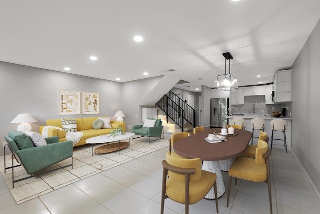 dining space featuring visible vents, recessed lighting, and stairs