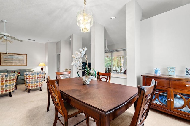 5166 SE Inkwood Way, Hobe Sound, FL 33455 - dining space featuring visible vents, ceiling fan with notable chandelier, and light colored carpet