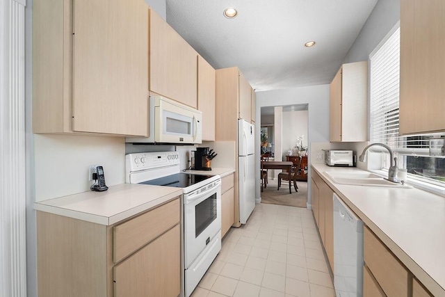 5166 SE Inkwood Way, Hobe Sound, FL 33455 - kitchen with light countertops, white appliances, light brown cabinets, and a sink