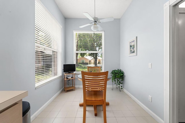 5166 SE Inkwood Way, Hobe Sound, FL 33455 - dining space with ceiling fan, a wealth of natural light, baseboards, and light tile patterned flooring