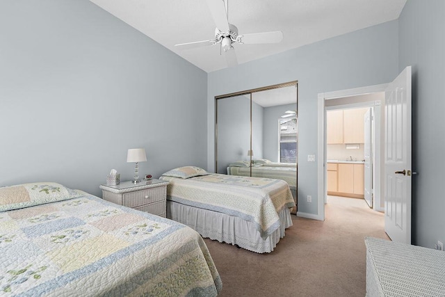 5166 SE Inkwood Way, Hobe Sound, FL 33455 - bedroom with a closet, vaulted ceiling, baseboards, carpet floors, and ceiling fan
