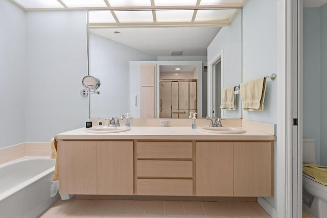5166 SE Inkwood Way, Hobe Sound, FL 33455 - full bath featuring a bath, a sink, toilet, double vanity, and a stall shower