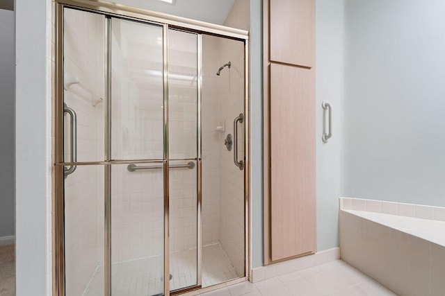5166 SE Inkwood Way, Hobe Sound, FL 33455 - bathroom with tile patterned floors and a shower stall