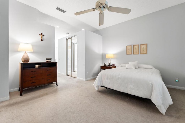 5166 SE Inkwood Way, Hobe Sound, FL 33455 - bedroom with visible vents, baseboards, a ceiling fan, and light colored carpet