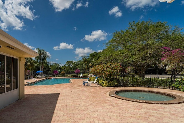 5166 SE Inkwood Way, Hobe Sound, FL 33455 - pool featuring a patio and a hot tub