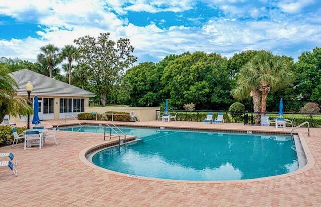 5166 SE Inkwood Way, Hobe Sound, FL 33455 - pool featuring a patio area and fence