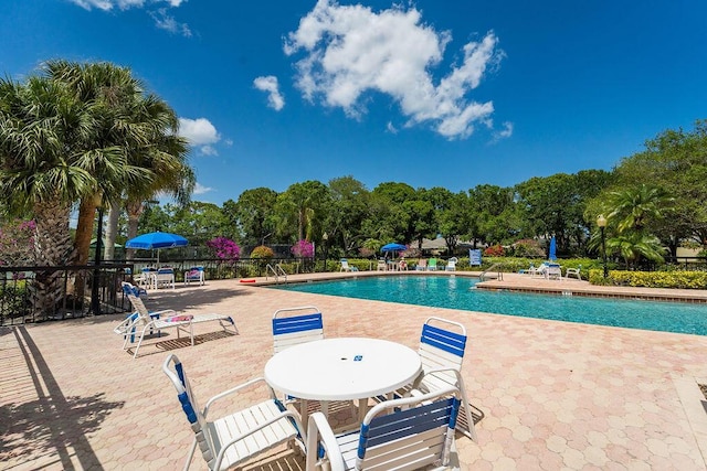 5166 SE Inkwood Way, Hobe Sound, FL 33455 - community pool featuring a patio area and fence