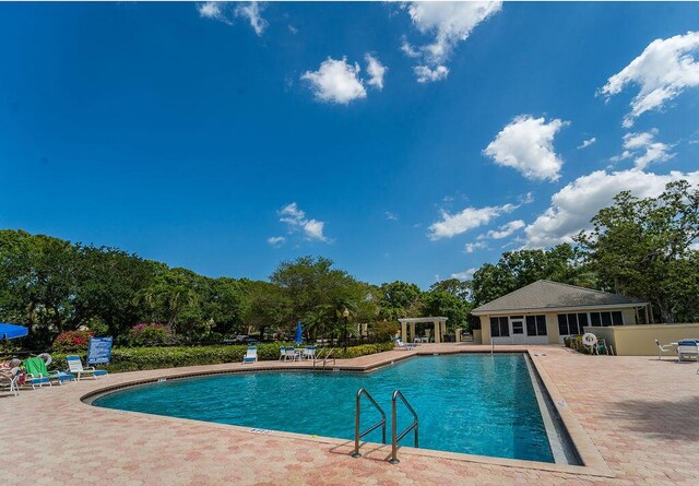 5166 SE Inkwood Way, Hobe Sound, FL 33455 - community pool with a patio