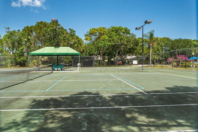 5166 SE Inkwood Way, Hobe Sound, FL 33455 - view of sport court with fence