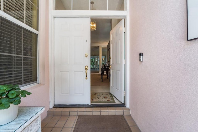 5166 SE Inkwood Way, Hobe Sound, FL 33455 - view of exterior entry featuring stucco siding
