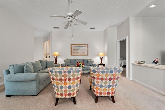 5166 SE Inkwood Way, Hobe Sound, FL 33455 - living area featuring visible vents, baseboards, a ceiling fan, and light carpet