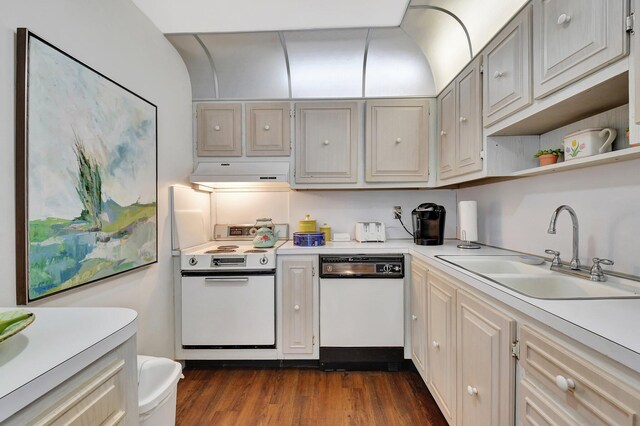 10129 43rd Dr S Unit 311, Boynton Beach, FL 33436 - kitchen featuring white appliances, under cabinet range hood, a sink, light countertops, and dark wood-style flooring