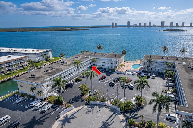 birds eye view of property featuring a view of city and a water view