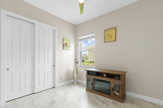 doorway to outside with marble finish flooring and baseboards
