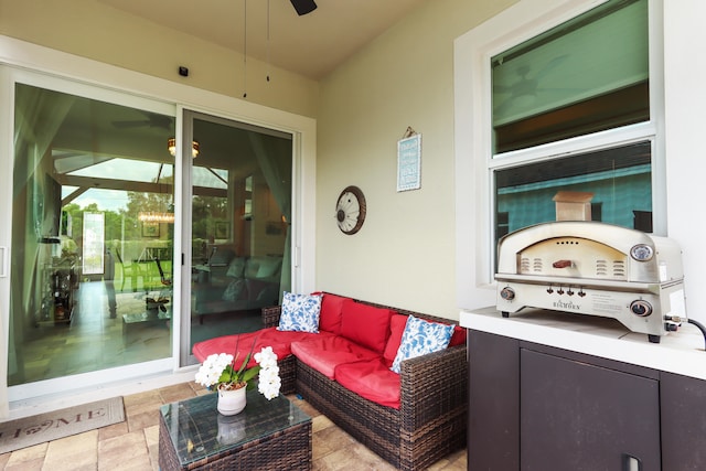 view of patio featuring a ceiling fan and an outdoor living space