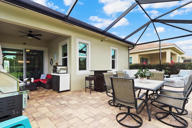 view of patio featuring an outdoor living space, a ceiling fan, a lanai, and outdoor dining space