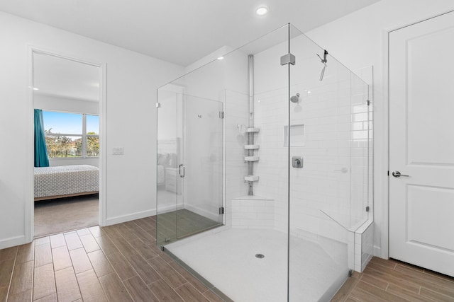 1218 Timber Reap Trl, The Acreage, FL 33470 - ensuite bathroom with recessed lighting, wood tiled floor, connected bathroom, and a shower stall