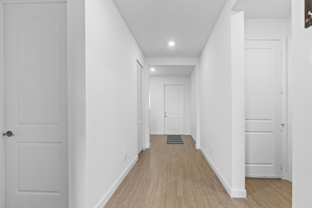 1218 Timber Reap Trl, The Acreage, FL 33470 - corridor featuring light wood-style flooring, baseboards, and recessed lighting