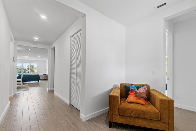 1218 Timber Reap Trl, The Acreage, FL 33470 - hallway with light wood-type flooring, visible vents, and baseboards